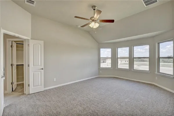 a view of an empty room with a window