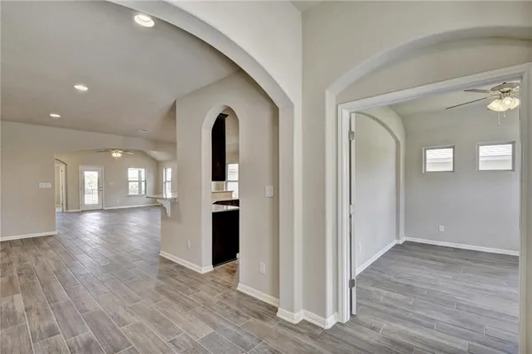 a view of a room with wooden floor