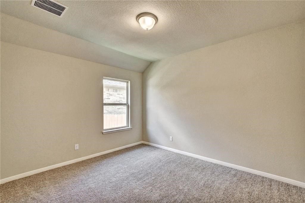 2208 Cabrillo Path Leander, TX 78641 - Photo 18 of 23 an empty room with windows and closet