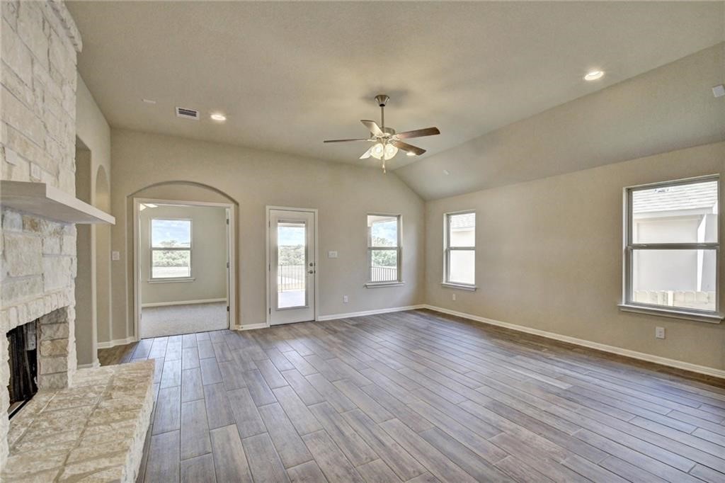 2208 Cabrillo Path Leander, TX 78641 - Photo 5 of 23 a view of an empty room with window and wooden floor