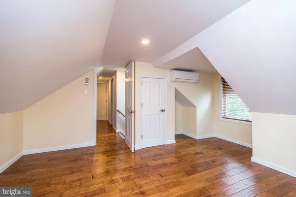 a view of hallway with wooden floor