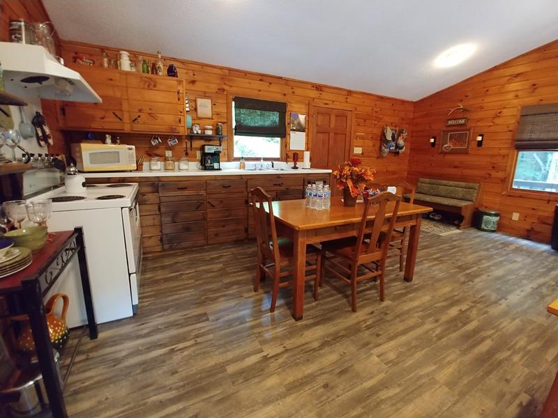 607 Dryhill Road Ferrum, VA 24088 - Photo 12 of 27 a dining hall with stainless steel appliances kitchen island granite countertop a table chairs and a stove