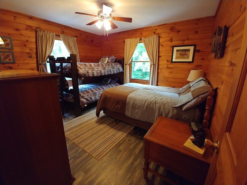 607 Dryhill Road Ferrum, VA 24088 - Photo 15 of 27 a bedroom with a bed window and dresser