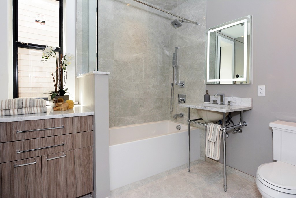 511 East 5th Street, Unit 2 Boston, MA 02127 - Photo 11 of 11 a bathroom with a sink mirror toilet and bathtub