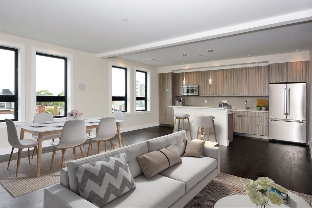 511 East 5th Street, Unit 2 Boston, MA 02127 - Photo 2 of 11 a living room with furniture and kitchen view