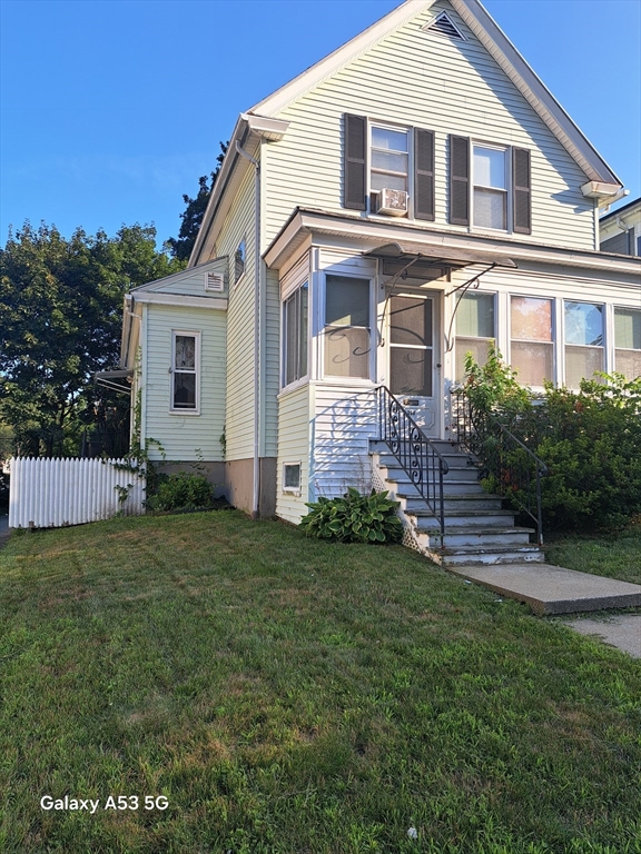 a front view of a house with a yard