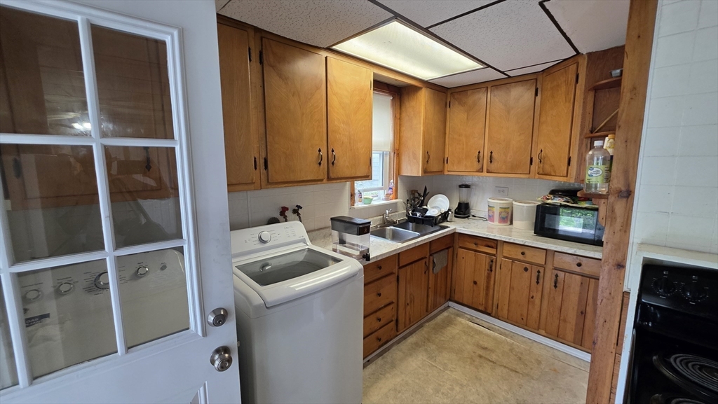 360 Hamilton Street Worcester, MA 01604 - Photo 8 of 35 a kitchen with a sink cabinets and appliances
