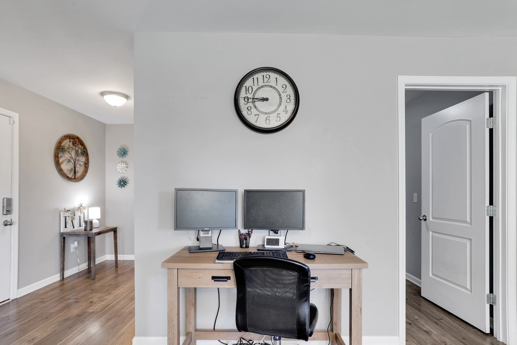 228 Scattersville Road Portland, TN 37148 - Photo 13 of 29 a view of a workspace with a table and a clock