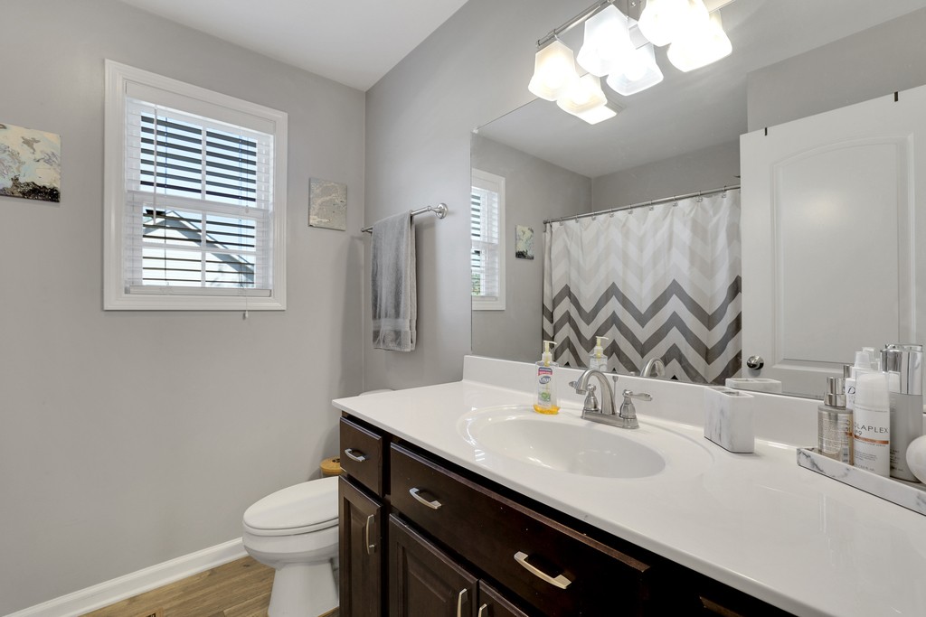 228 Scattersville Road Portland, TN 37148 - Photo 21 of 29 a bathroom with a sink and a mirror