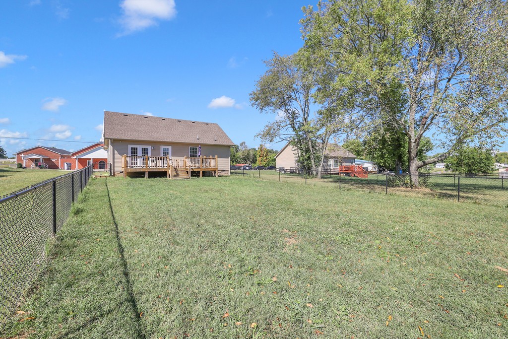 228 Scattersville Road Portland, TN 37148 - Photo 28 of 29 a backyard of a house with table and chairs