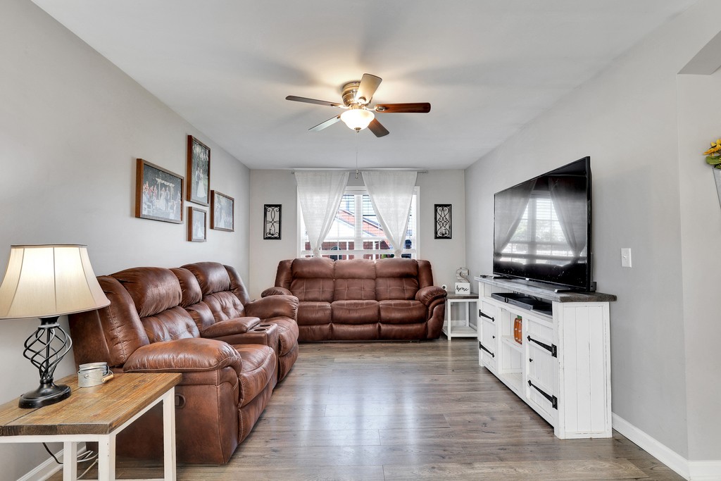 228 Scattersville Road Portland, TN 37148 - Photo 5 of 29 a living room with furniture a fireplace and a flat screen tv