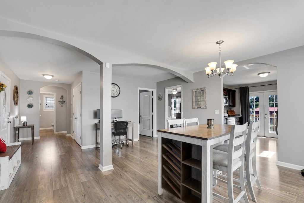 228 Scattersville Road Portland, TN 37148 - Photo 8 of 29 a view of a dining room with furniture and wooden floor