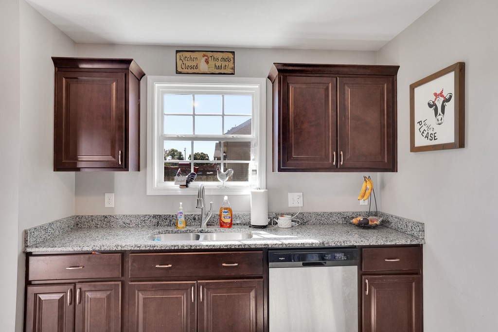 228 Scattersville Road Portland, TN 37148 - Photo 10 of 29 a kitchen with granite countertop a sink and cabinets