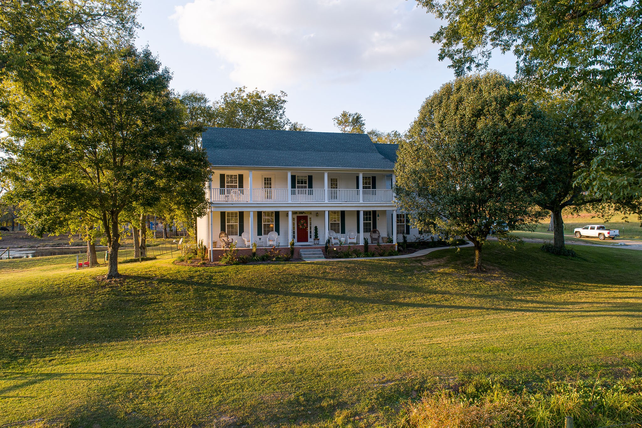 4685 Highway 64 Rutherfordton, NC 28139 - Photo 1 of 50 a view of a large pool with lawn chairs under an umbrella