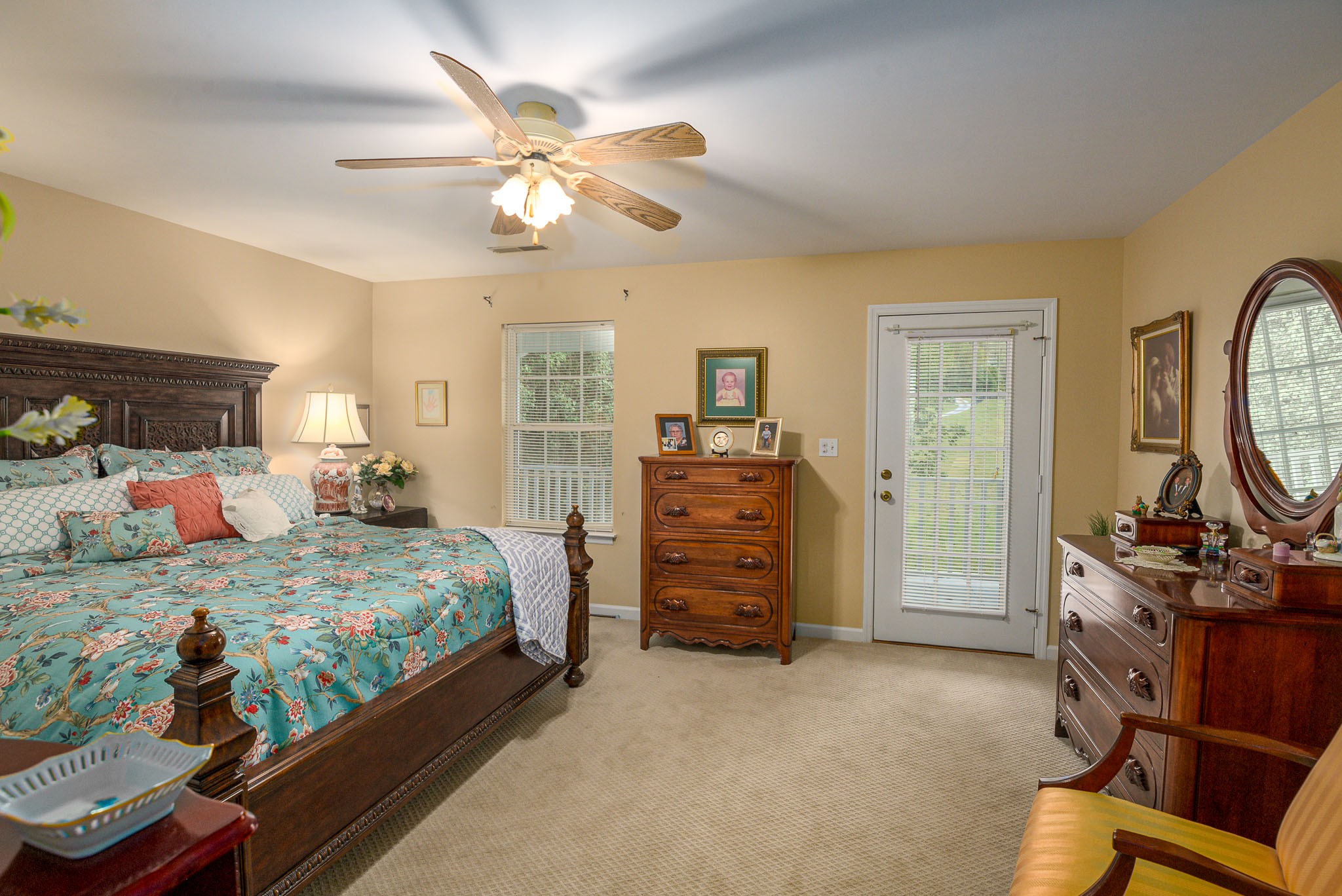4685 Highway 64 Rutherfordton, NC 28139 - Photo 35 of 50 a bedroom with a bed and a chandelier