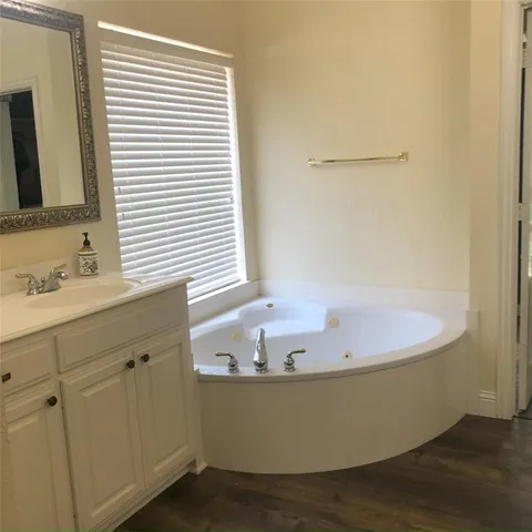 a bedroom with a bed and a table