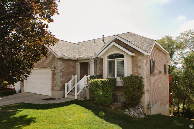 Brick exterior with stone accents and a gabled roofline