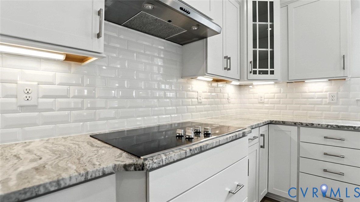3164 Three Chopt Road Gum Spring, VA 23065 - Photo 3 of 13 a kitchen with granite countertop a sink a stove and cabinets