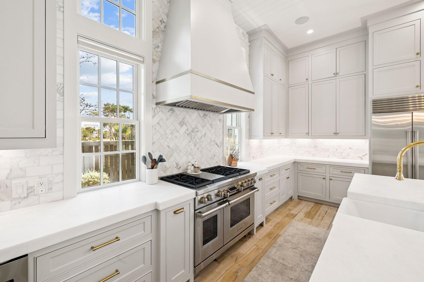 25 Peace Ln Inlet Beach Inlet Beach, FL 32461 - Photo 13 of 85 a kitchen with a stove a sink and a window