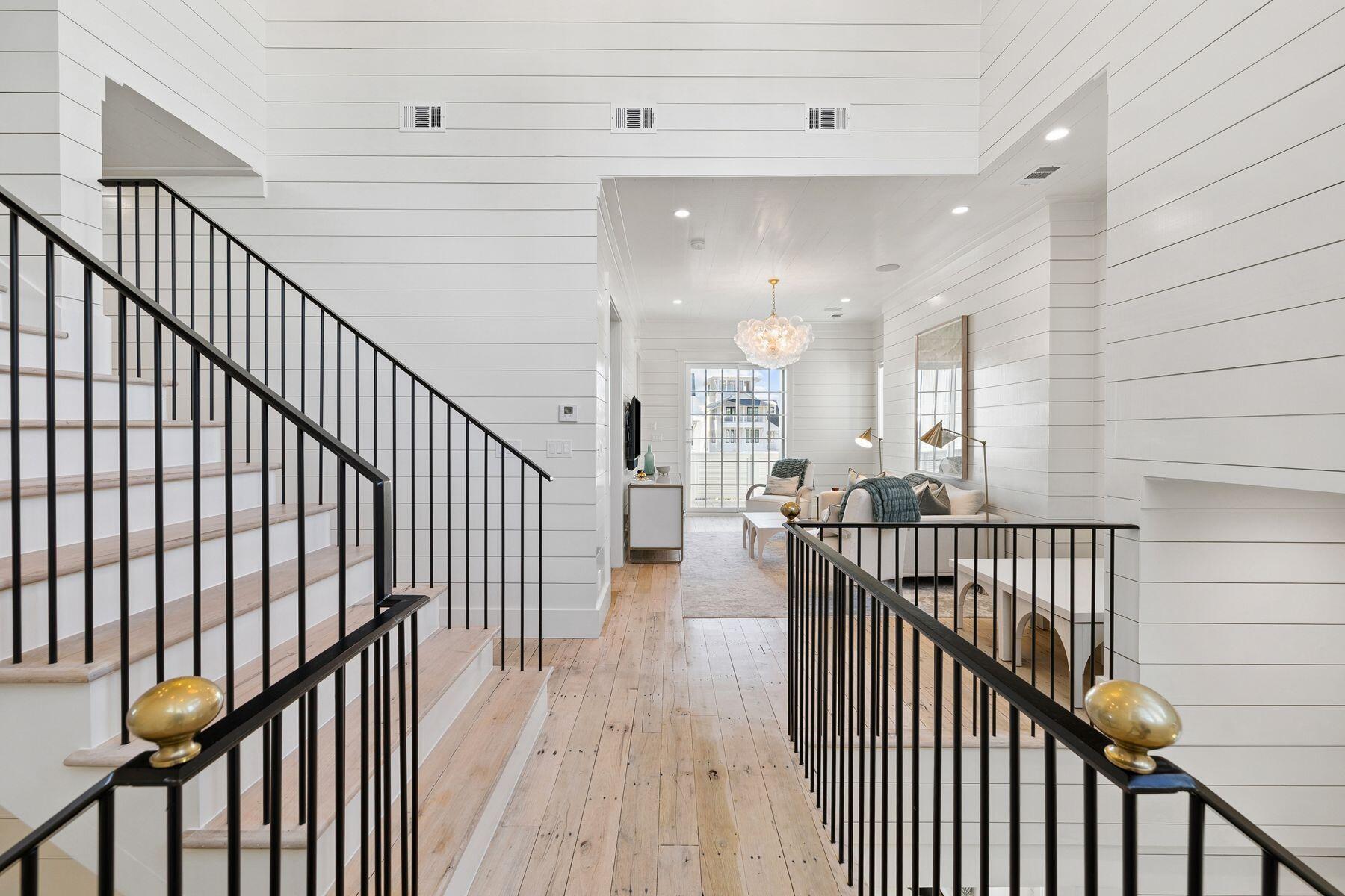 25 Peace Ln Inlet Beach Inlet Beach, FL 32461 - Photo 42 of 85 a view of a hallway with wooden floor and stairs