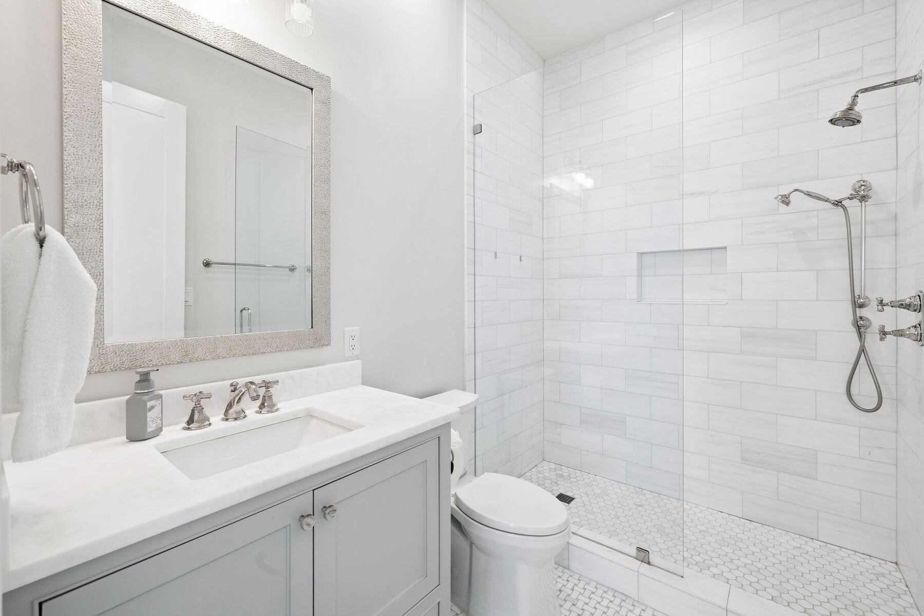 25 Peace Ln Inlet Beach Inlet Beach, FL 32461 - Photo 59 of 85 a bathroom with a sink toilet a mirror and shower