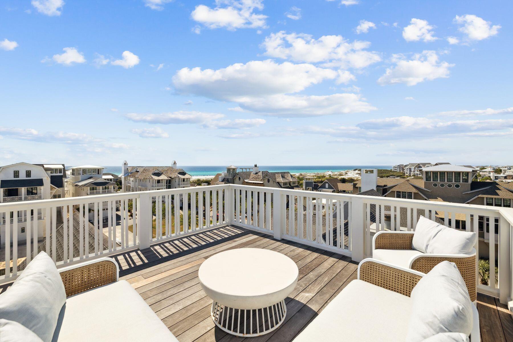 25 Peace Ln Inlet Beach Inlet Beach, FL 32461 - Photo 66 of 85 a view of a balcony with two chairs and a table