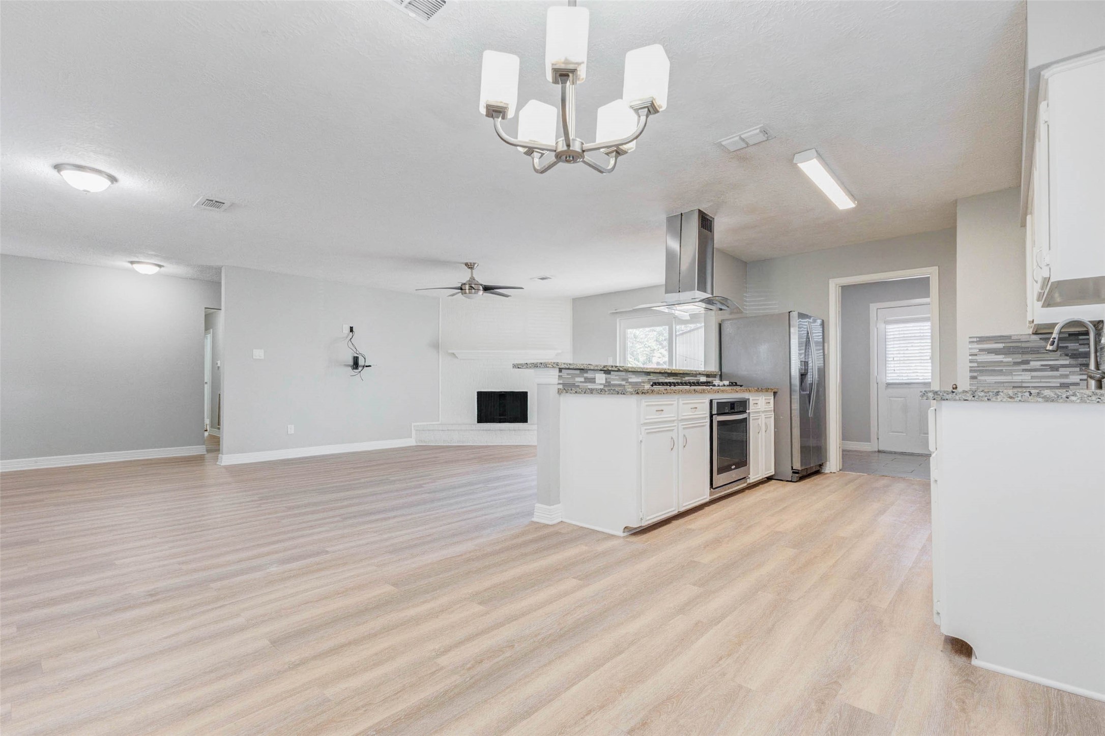 18526 Fenske Road Cypress, TX 77433 - Photo 16 of 32 This area accommodates a full size table and chairs and offers convenient access to the kitchen, dining room, and living room.