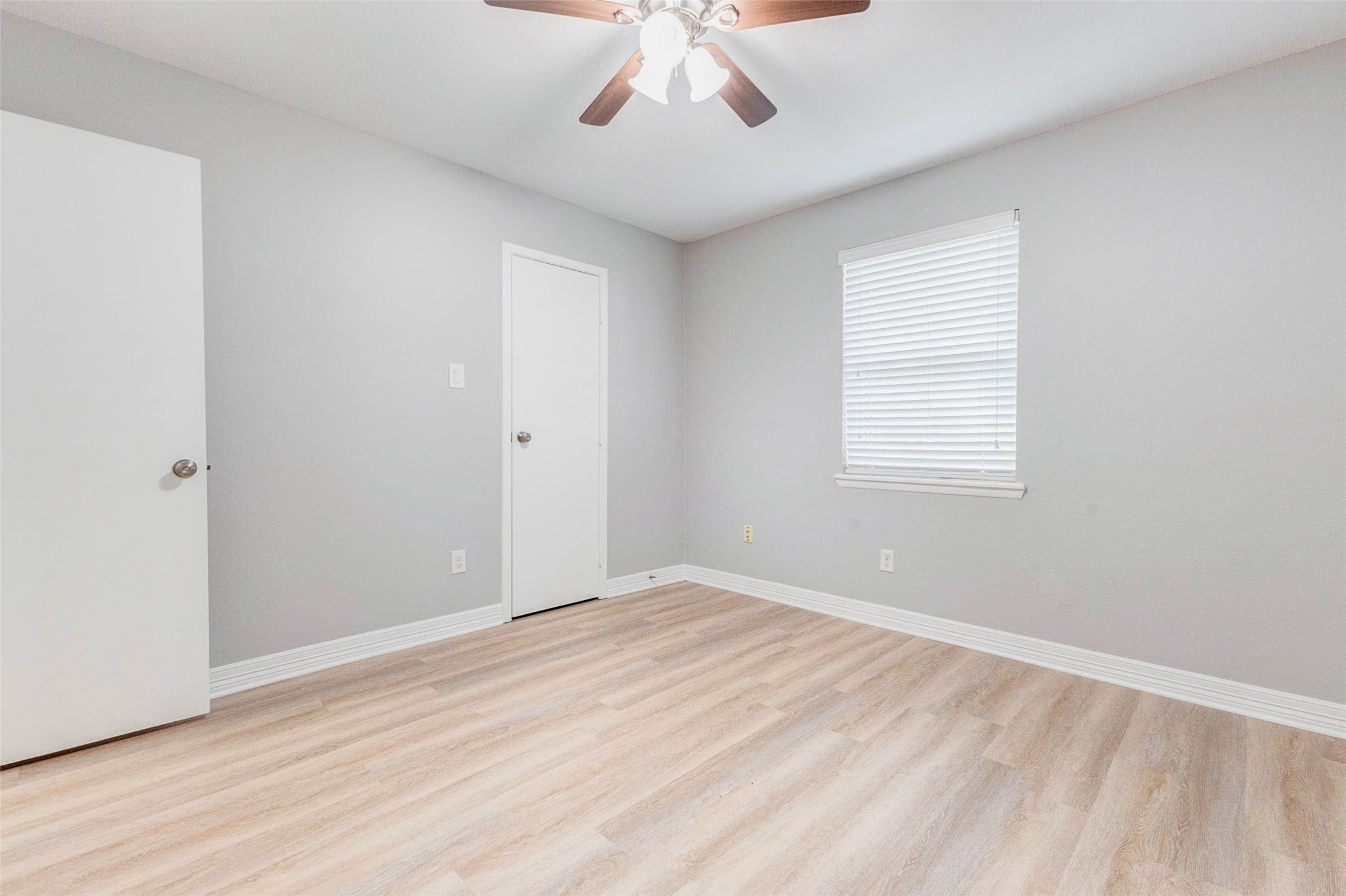 18526 Fenske Road Cypress, TX 77433 - Photo 23 of 32 This home includes two secondary bedrooms, each featuring a ceiling fan, luxury vinyl flooring, and neutral paint.