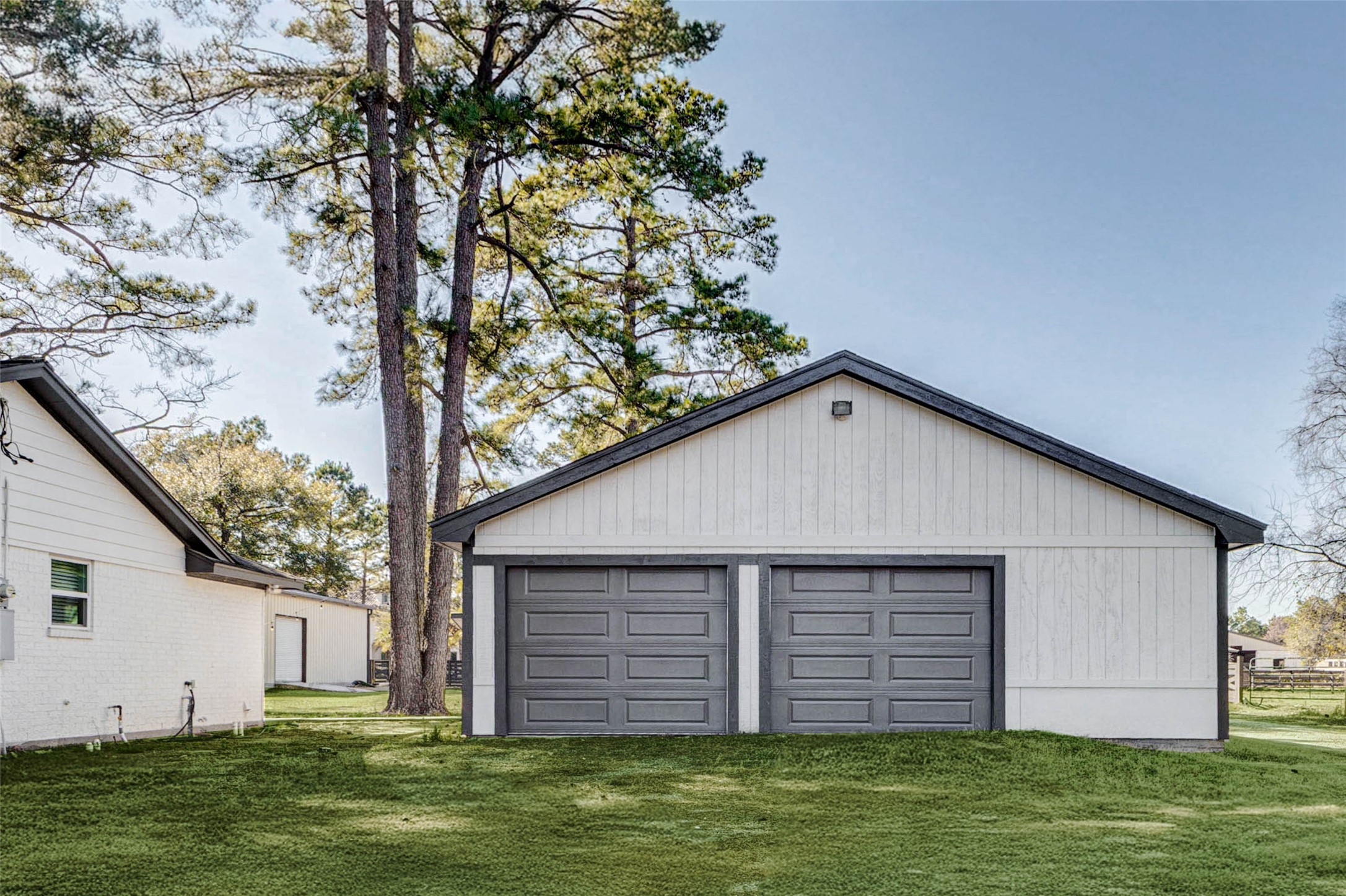 18526 Fenske Road Cypress, TX 77433 - Photo 4 of 32 A closer look at the garage reveals two bays and an extended area ideal for storage, a workshop, or a fitness space.