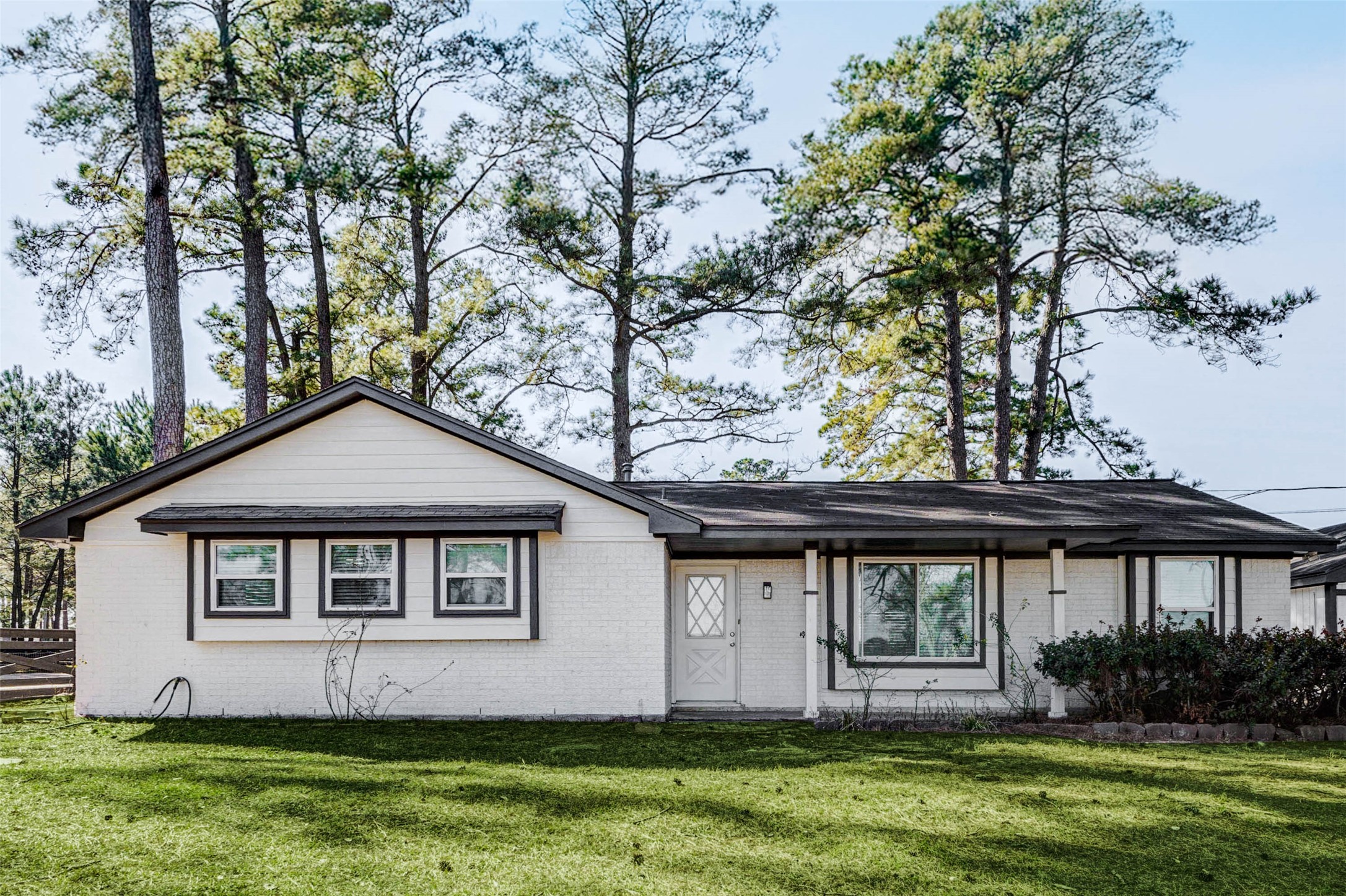18526 Fenske Road Cypress, TX 77433 - Photo 5 of 32 The exterior features a brick and cement board façade, bright windows, dark accents and a welcoming front porch.