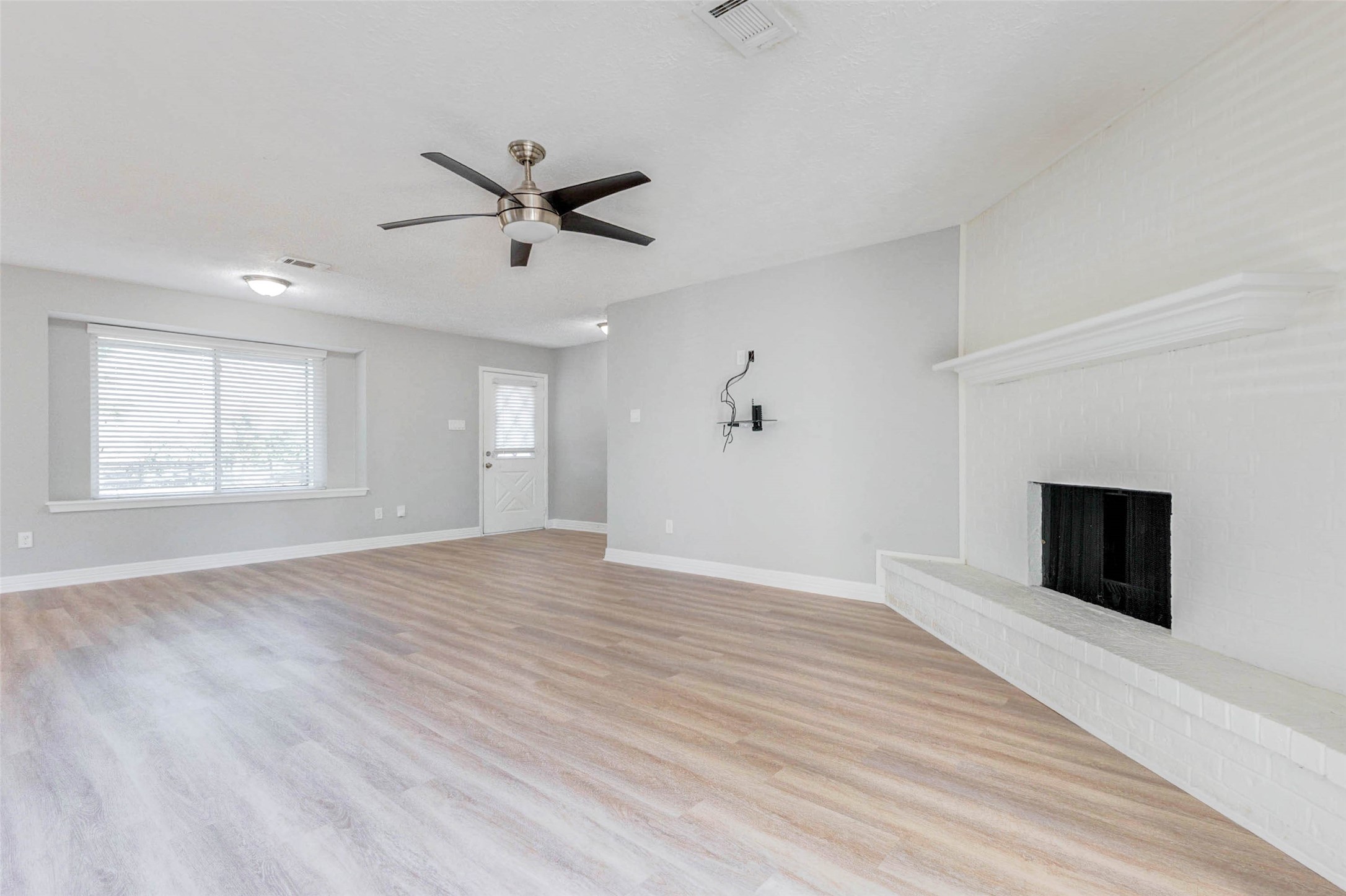 18526 Fenske Road Cypress, TX 77433 - Photo 32 of 32 An alternate view of the living area highlights the open floor plan, with the main living spaces easily connected while the bedrooms are set apart for privacy.