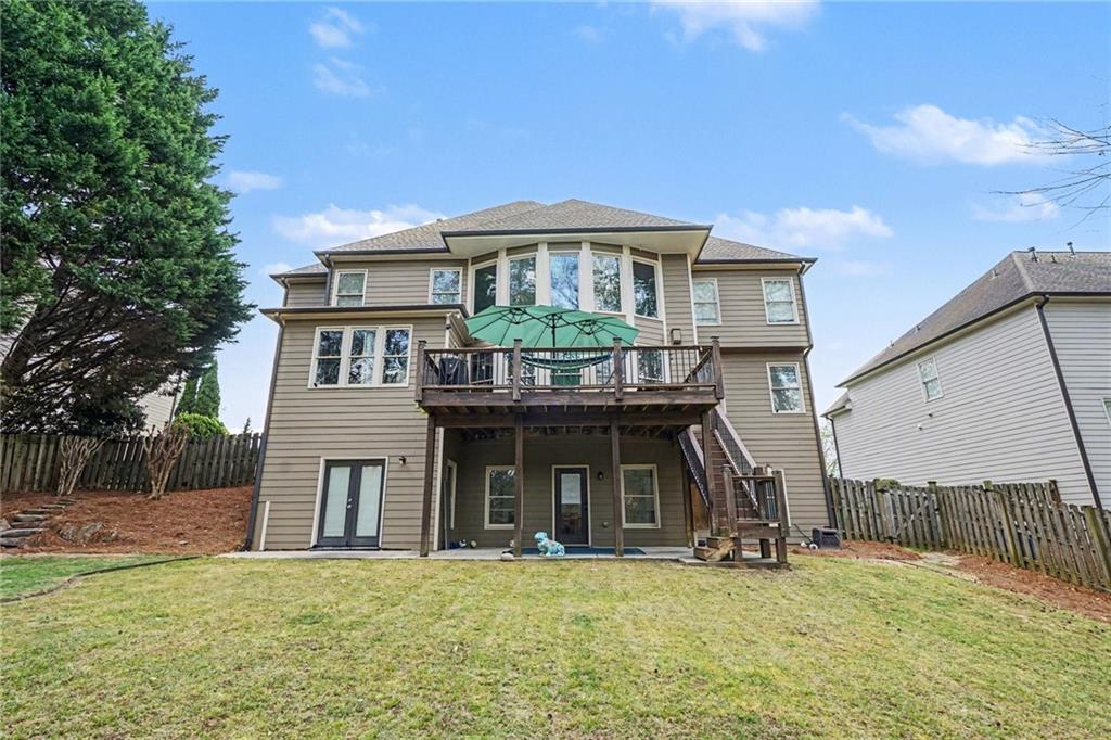 1958 Mapmaker Drive Northeast Dacula, GA 30019 - Photo 28 of 35 a front view of a house with a yard