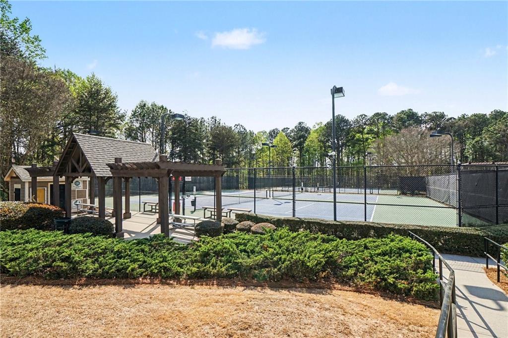 1958 Mapmaker Drive Northeast Dacula, GA 30019 - Photo 34 of 35 a view of a house with a backyard and a garden