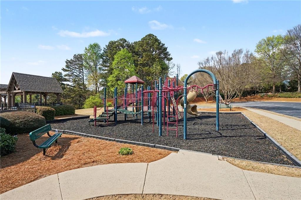 1958 Mapmaker Drive Northeast Dacula, GA 30019 - Photo 35 of 35 a view of a swimming pool with a lounge chairs