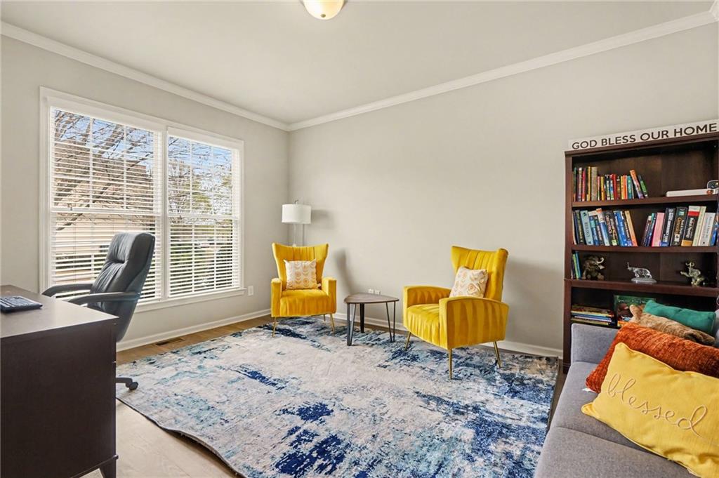 1958 Mapmaker Drive Northeast Dacula, GA 30019 - Photo 5 of 35 a bedroom with furniture and a window