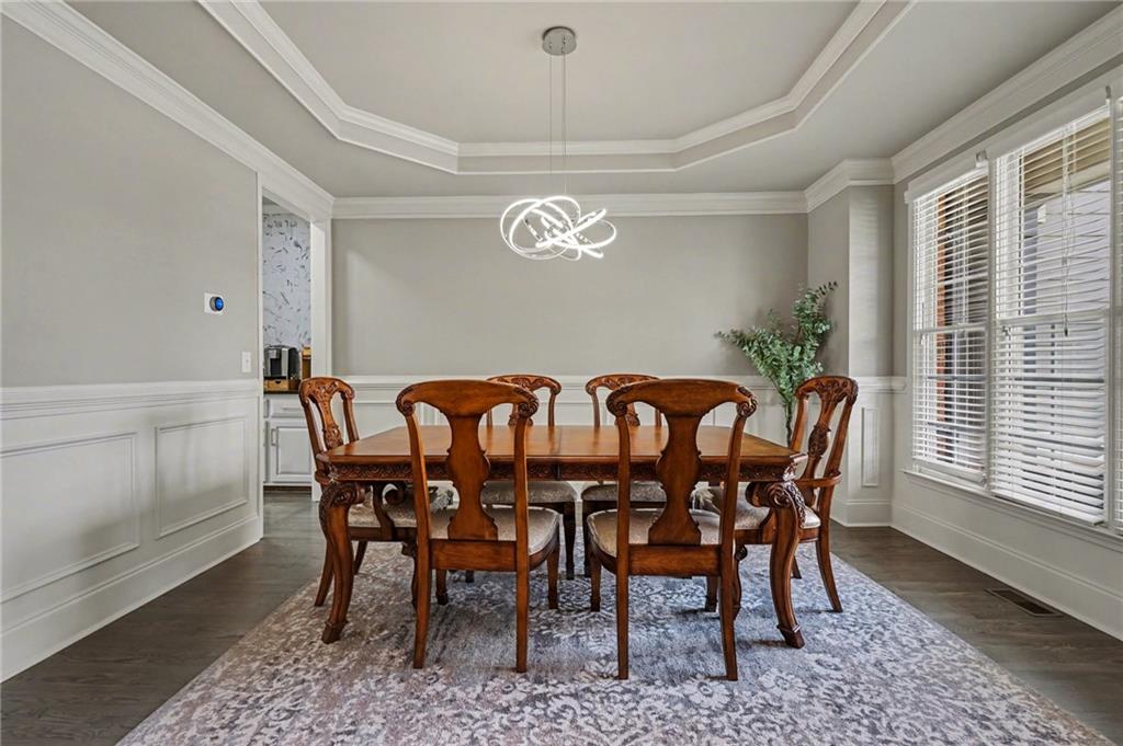 1958 Mapmaker Drive Northeast Dacula, GA 30019 - Photo 7 of 35 a view of a dining room with furniture window and wooden floor