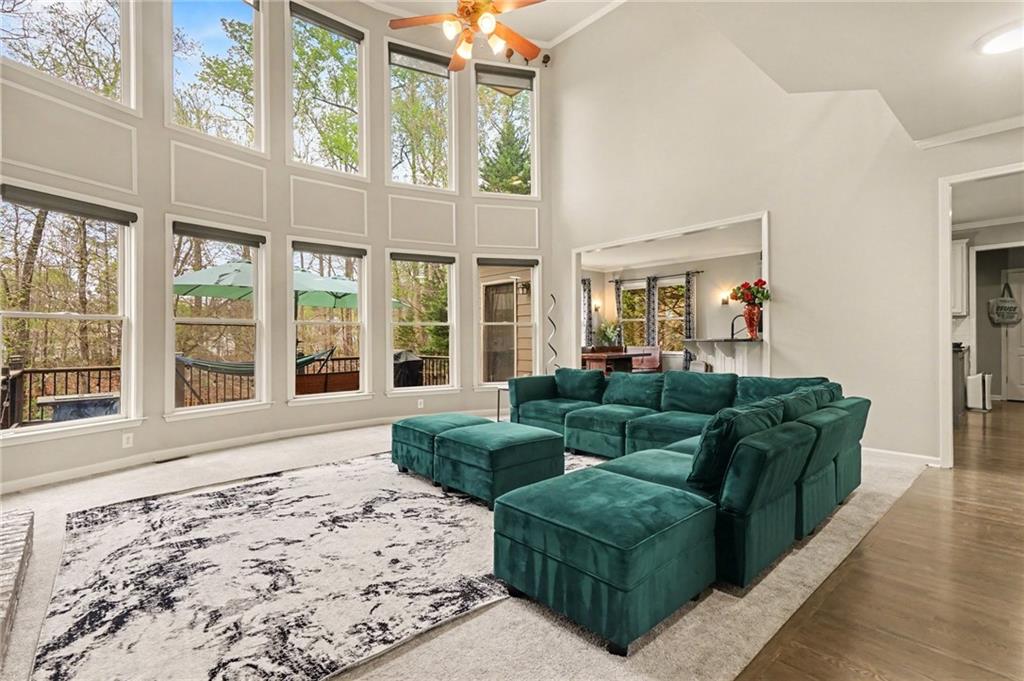 1958 Mapmaker Drive Northeast Dacula, GA 30019 - Photo 8 of 35 a living room with furniture and windows