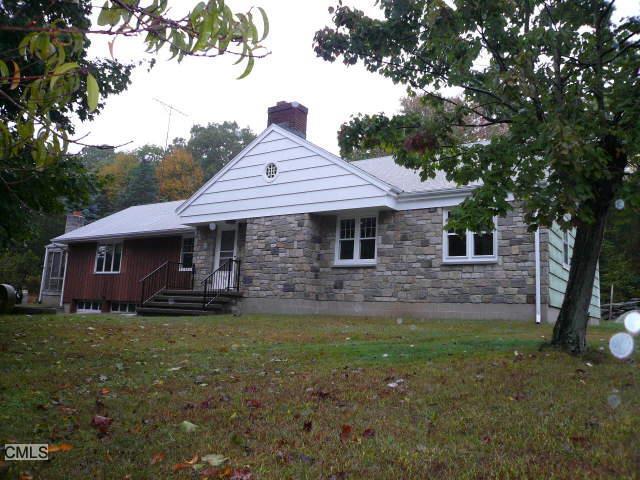 25 Fensky Road Easton, CT 06612 - Photo 1 of 1 a front view of a house with garden