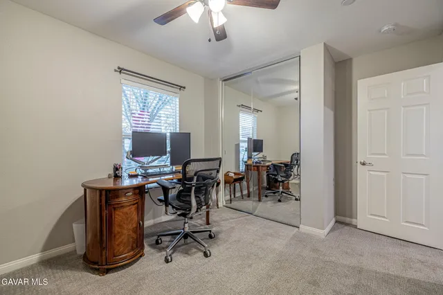 a view of a livingroom with furniture and a window