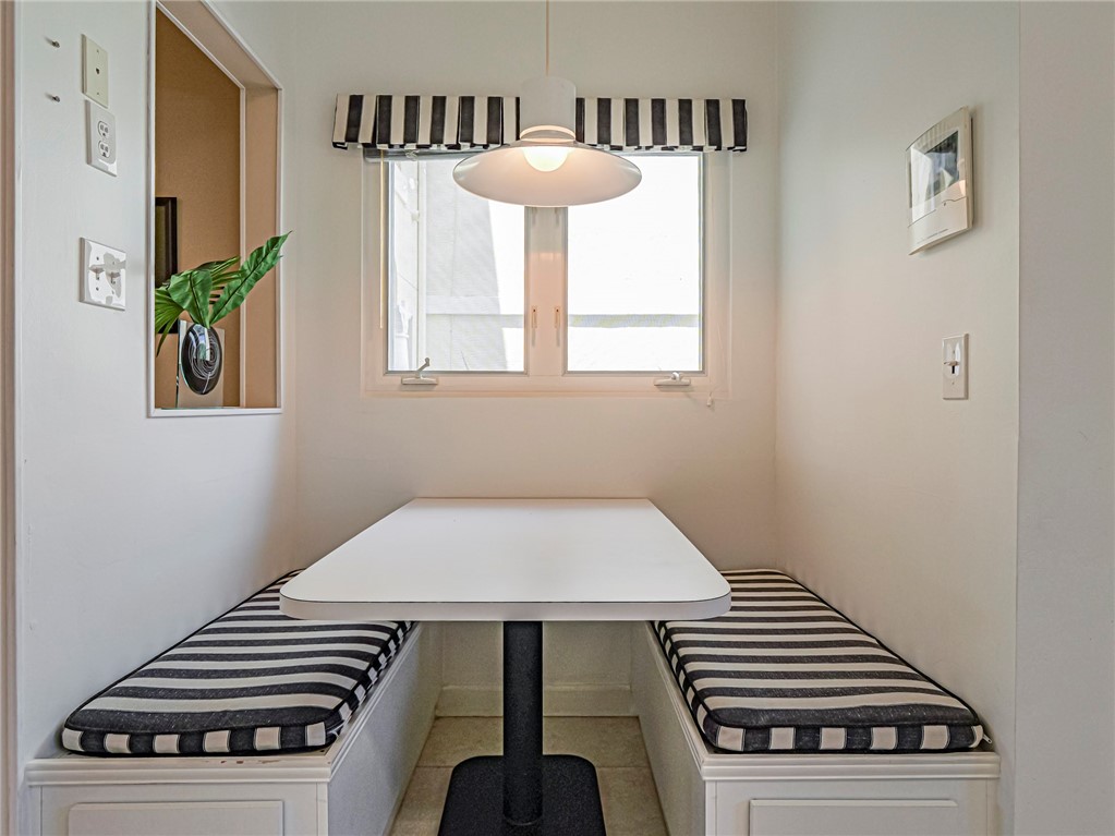 5035 Harmony Circle, Unit 101 Vero Beach, FL 32967 - Photo 13 of 36 a view of a livingroom with furniture and staircase