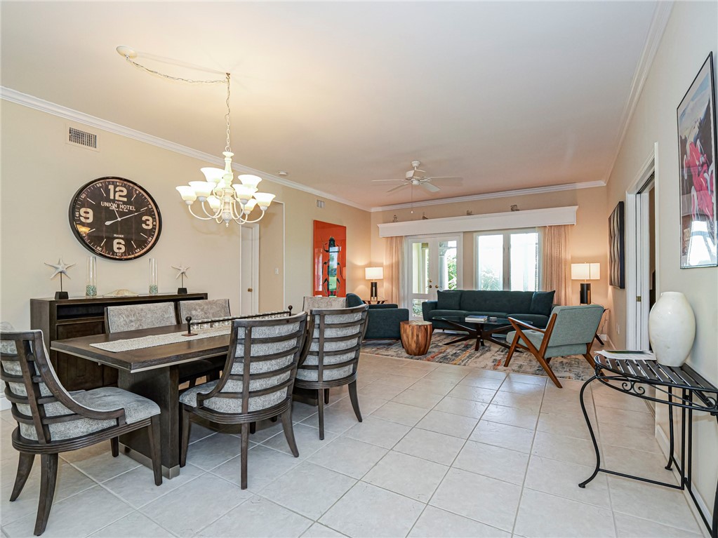 5035 Harmony Circle, Unit 101 Vero Beach, FL 32967 - Photo 16 of 36 a view of a dining room with furniture