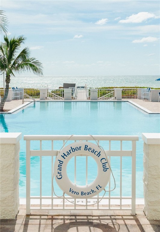 5035 Harmony Circle, Unit 101 Vero Beach, FL 32967 - Photo 30 of 36 a view of a swimming pool with a terrace