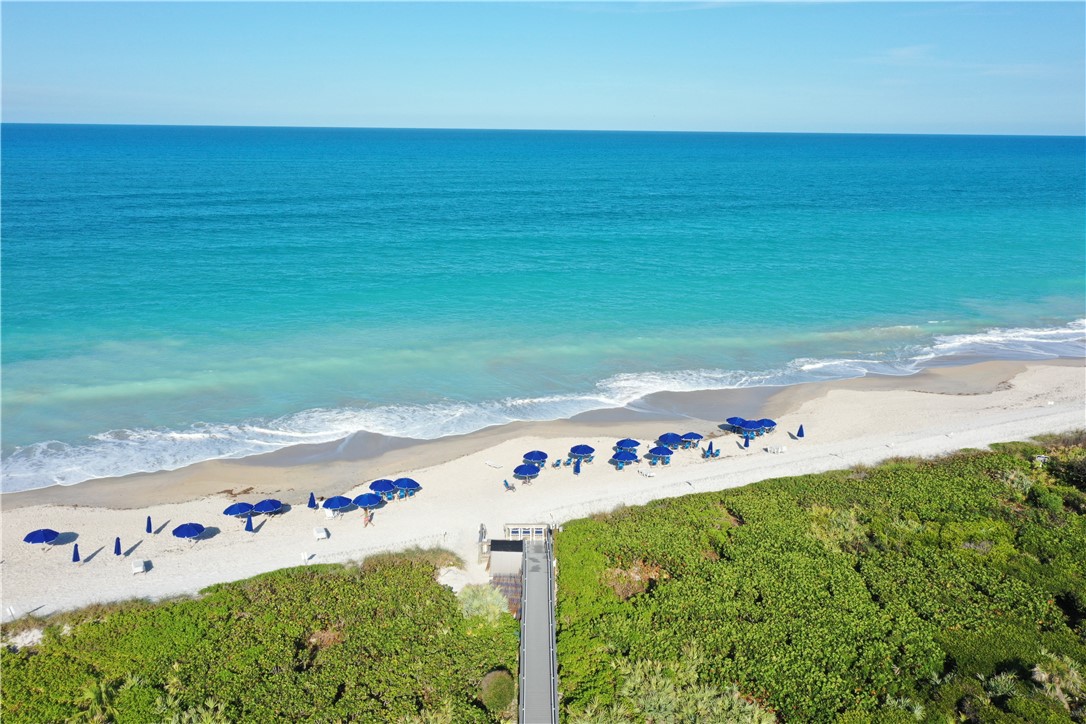 5035 Harmony Circle, Unit 101 Vero Beach, FL 32967 - Photo 31 of 36 a view of an ocean with a big yard