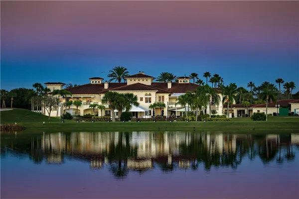 an aerial view of residential houses with outdoor space and swimming pool