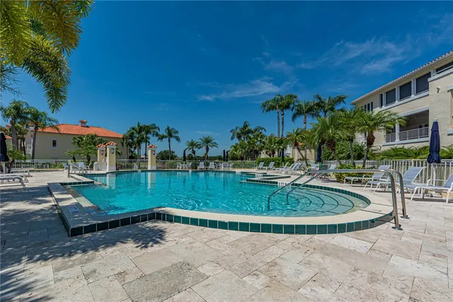 a view of a swimming pool with a patio