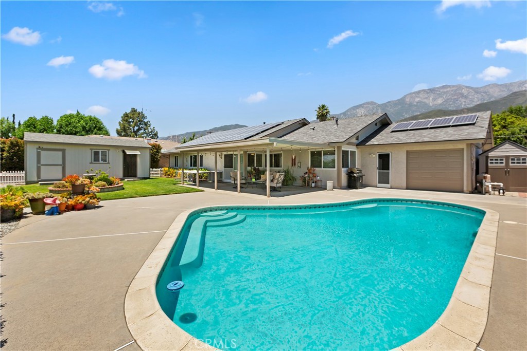 8527 Hillside Road Rancho Cucamonga, CA 91701 - Photo 32 of 50 a view of a house with swimming pool and porch