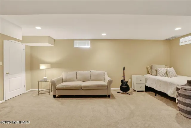 a living room with furniture and white walls