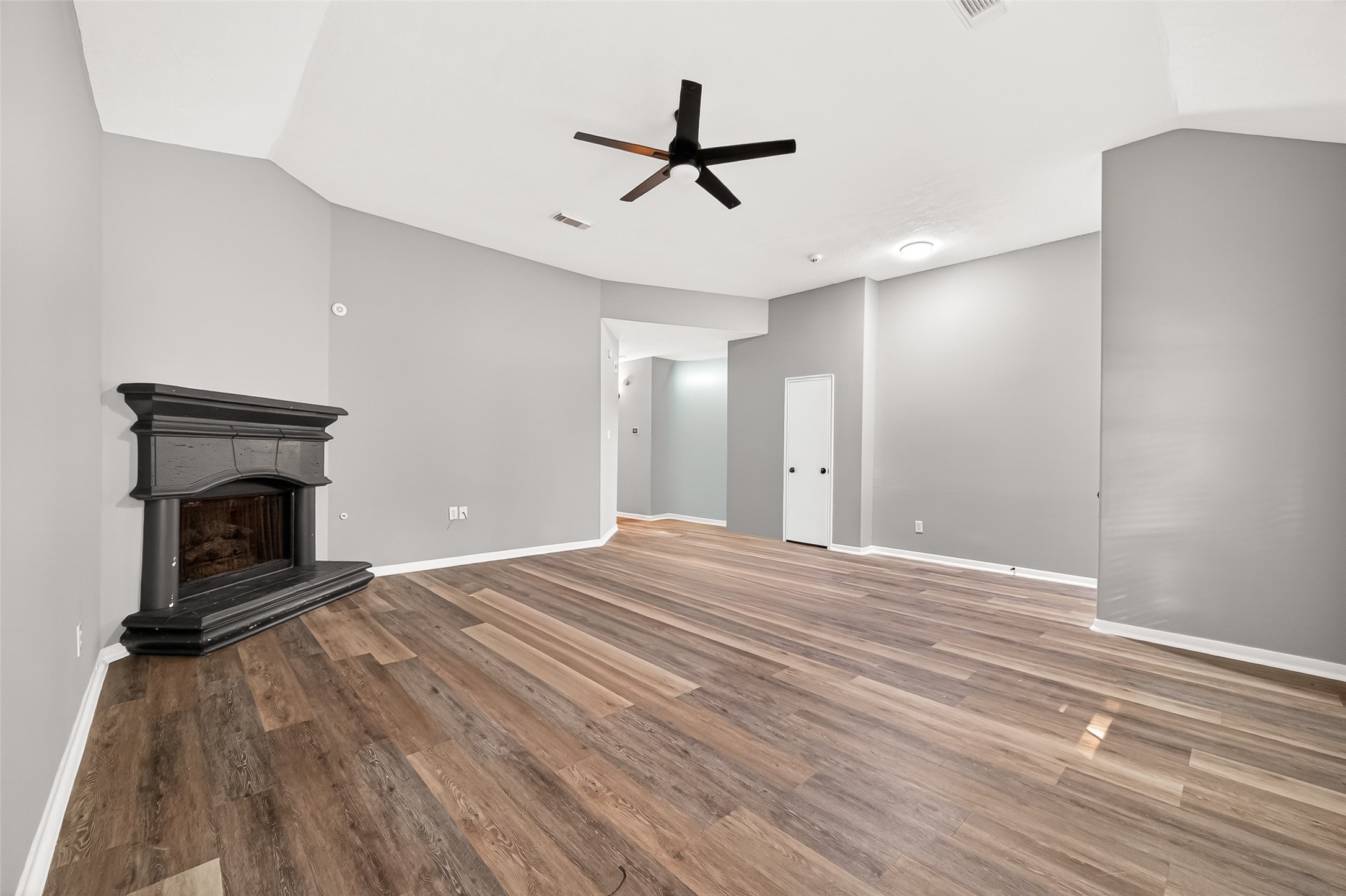 23810 Spring Way Drive Spring, TX 77373 - Photo 2 of 35 a view of empty room with wooden floor and a fireplace