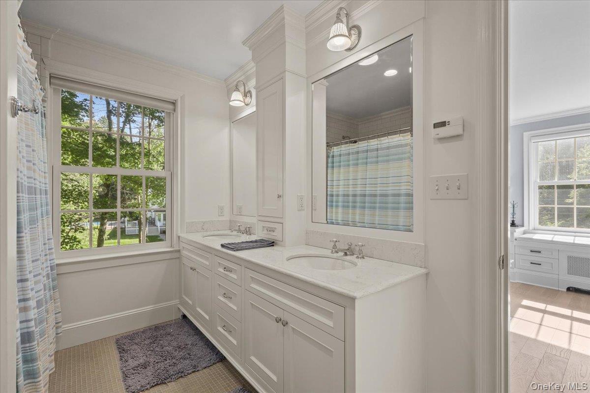 135 Pines Bridge Road Katonah, NY 10536 - Photo 26 of 40 a bathroom with a sink and a window