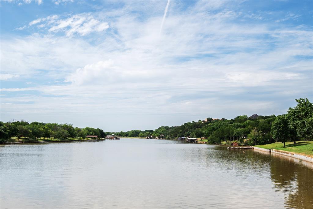 2312 Cactus Rio Lane Weatherford, TX 76087 - Photo 15 of 37 a view of a lake with houses in the back